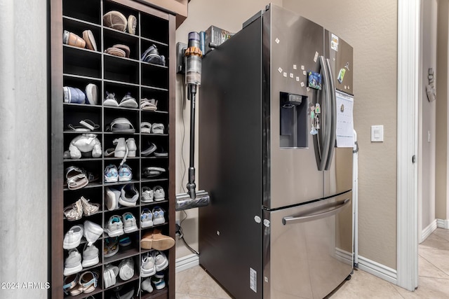 walk in closet featuring light tile patterned floors