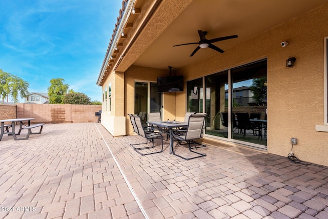 view of patio featuring ceiling fan