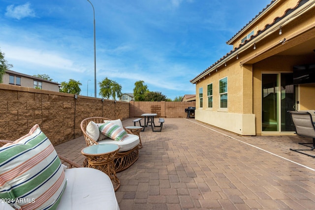 view of patio featuring outdoor lounge area and area for grilling