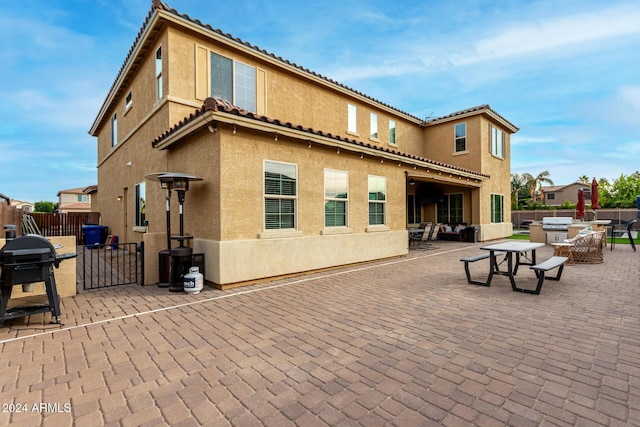 rear view of house featuring a patio area