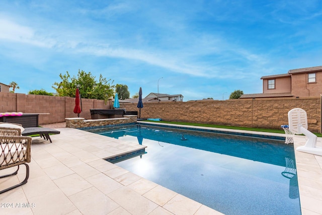 view of swimming pool with a patio