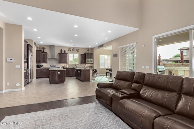 living room with light hardwood / wood-style flooring and sink