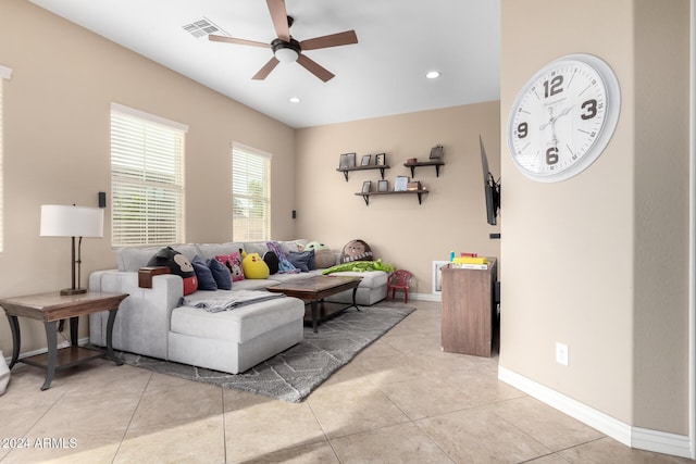 living room with ceiling fan and light tile patterned flooring