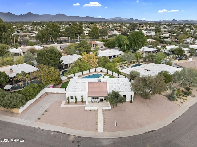 birds eye view of property with a mountain view