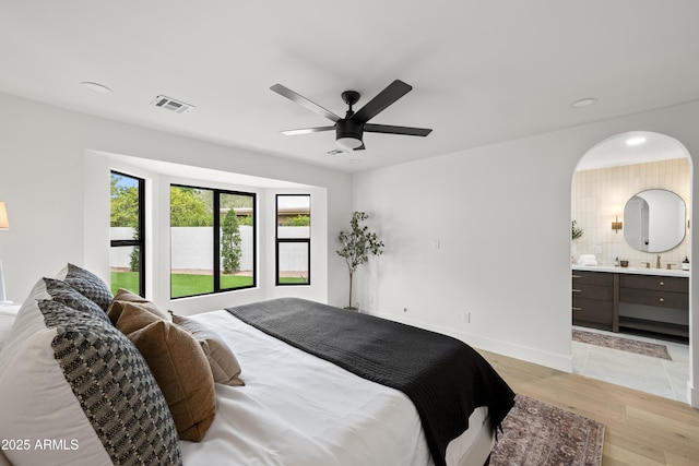 bedroom with recessed lighting, visible vents, light wood-style flooring, and baseboards