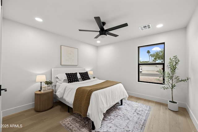 bedroom featuring visible vents, wood finished floors, and recessed lighting