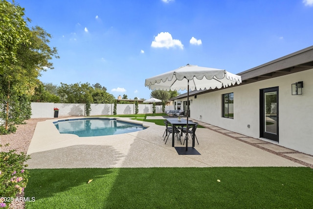 view of pool with a yard, a patio area, a fenced backyard, and a fenced in pool