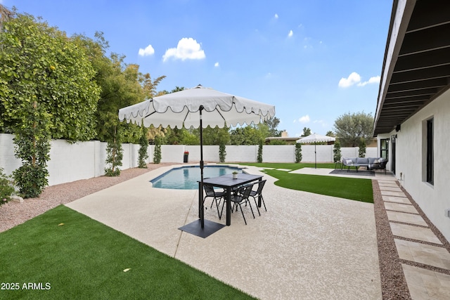 view of patio with an outdoor hangout area, a fenced backyard, and a fenced in pool