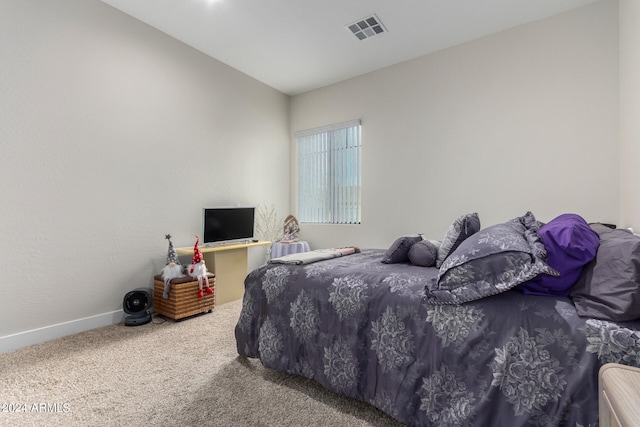 carpeted bedroom with lofted ceiling