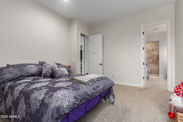 carpeted bedroom featuring connected bathroom