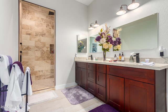 bathroom featuring vanity and an enclosed shower