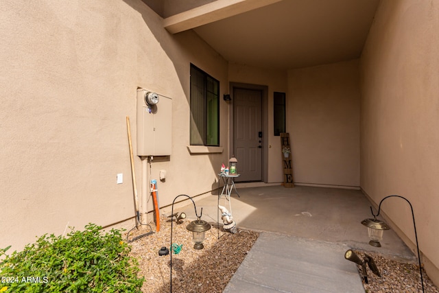 doorway to property with a patio