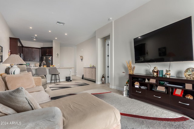 living room featuring light carpet