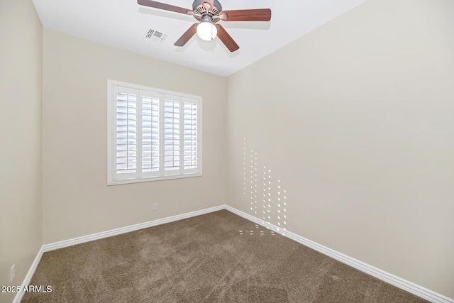 carpeted spare room featuring a ceiling fan, visible vents, and baseboards