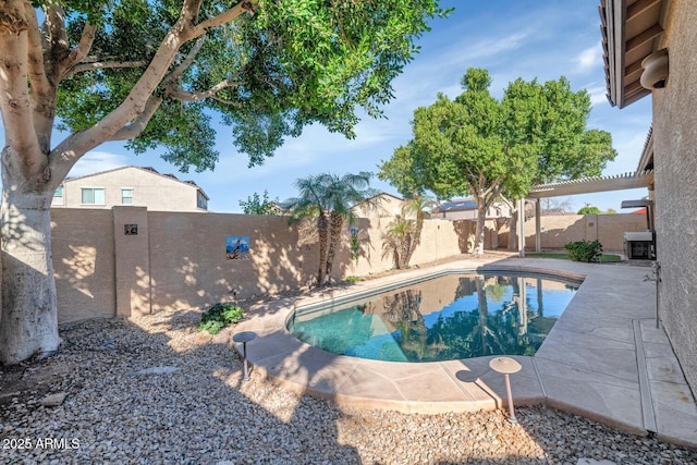 view of pool with a fenced in pool, a fenced backyard, and a pergola