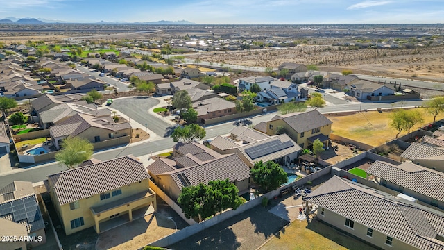 drone / aerial view featuring a residential view and a mountain view