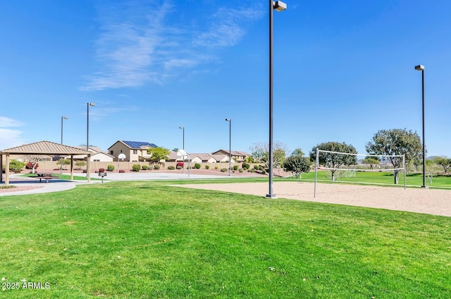 view of property's community featuring volleyball court, a yard, a residential view, and a gazebo