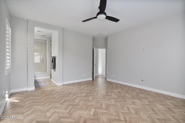 unfurnished room featuring ceiling fan and light parquet floors