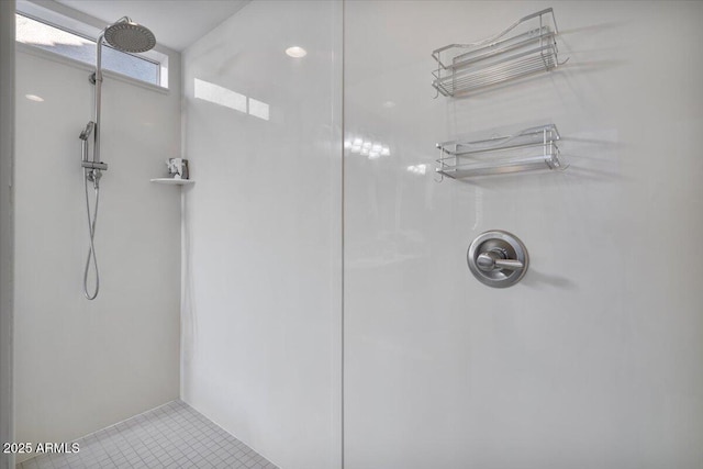 bathroom featuring walk in shower and tile patterned flooring