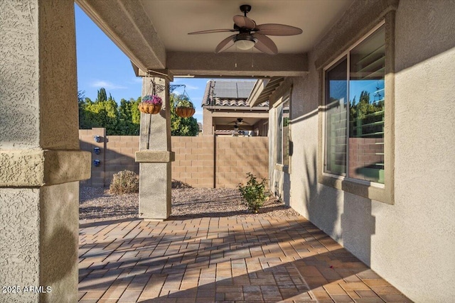 view of patio featuring ceiling fan