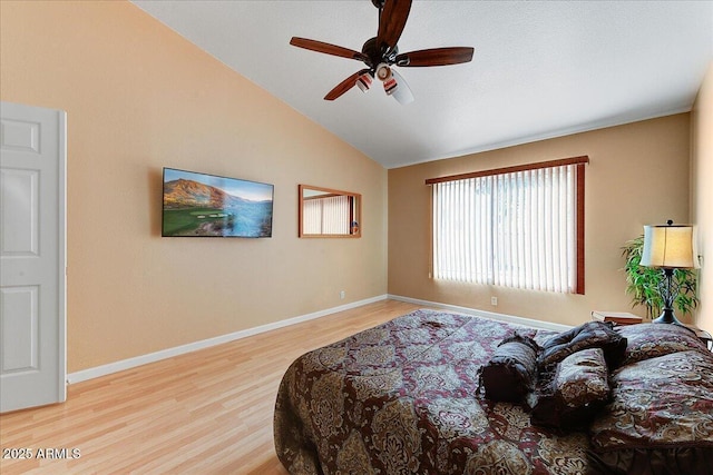 bedroom with lofted ceiling, ceiling fan, and light hardwood / wood-style floors