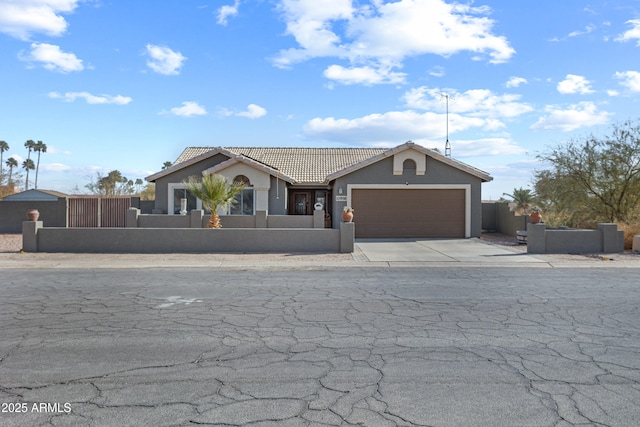 ranch-style home featuring a garage