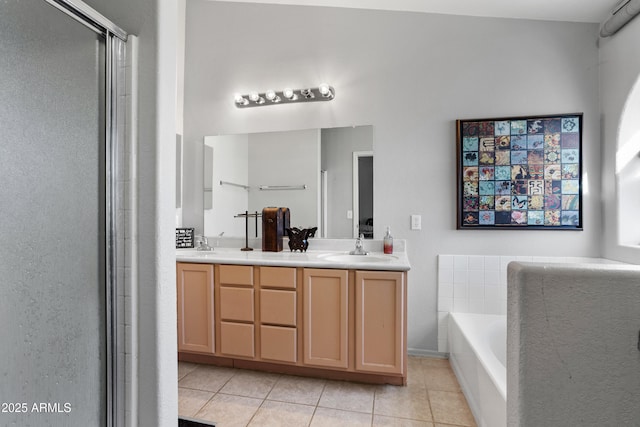 bathroom featuring shower with separate bathtub, tile patterned floors, and vanity