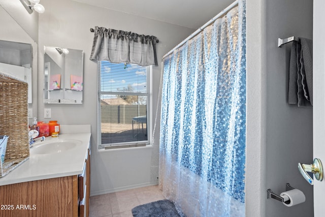 bathroom with vanity, curtained shower, and tile patterned floors