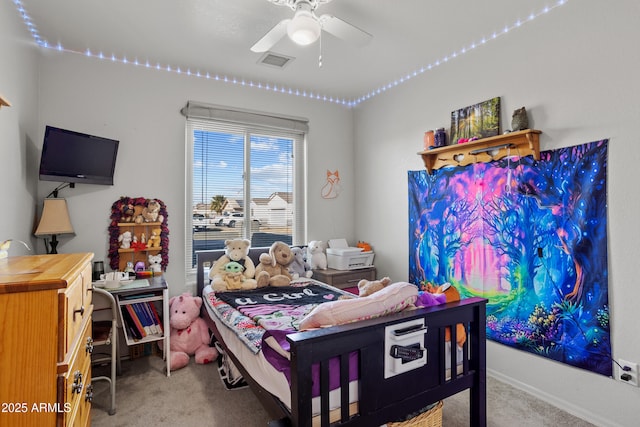 carpeted bedroom featuring ceiling fan