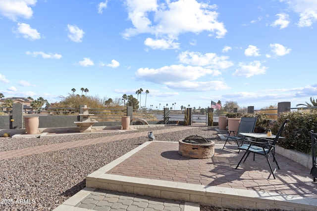 view of patio with an outdoor fire pit