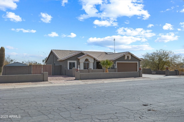 single story home featuring a garage