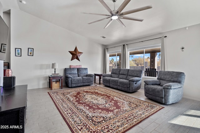 living room featuring hardwood / wood-style flooring and ceiling fan