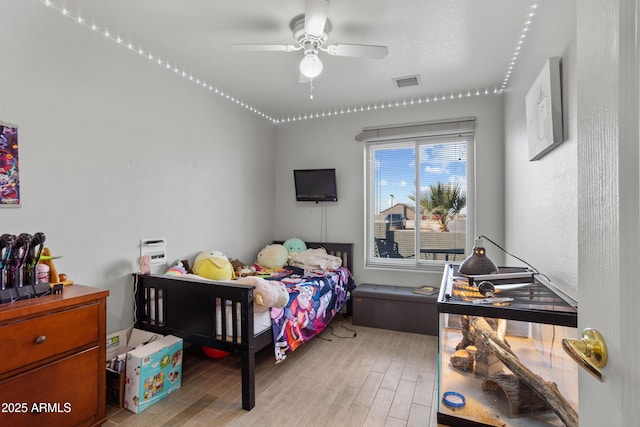 bedroom featuring ceiling fan and light hardwood / wood-style flooring