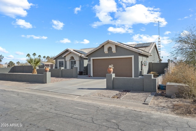 single story home featuring a garage and solar panels