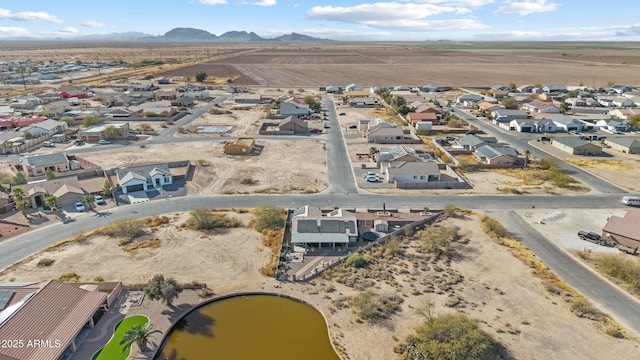 birds eye view of property featuring a mountain view