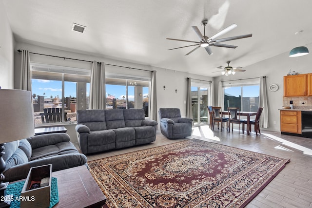 living room with hardwood / wood-style floors and a healthy amount of sunlight