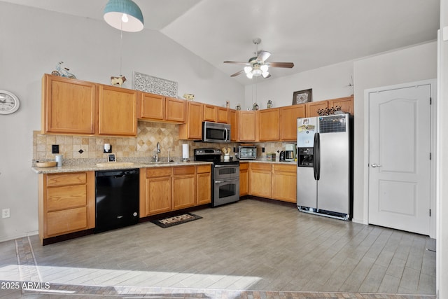 kitchen featuring high vaulted ceiling, sink, decorative backsplash, stainless steel appliances, and light hardwood / wood-style flooring