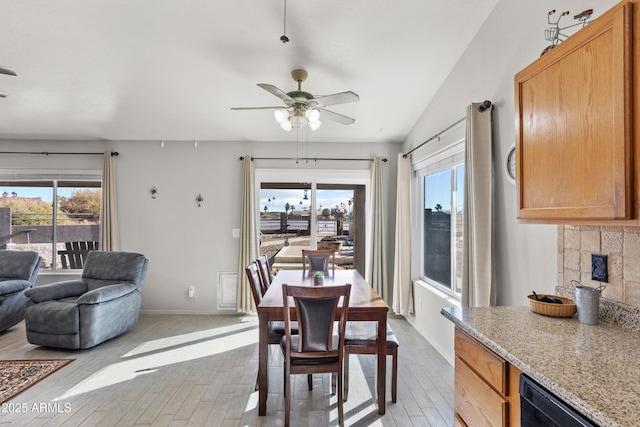 dining area with plenty of natural light and ceiling fan