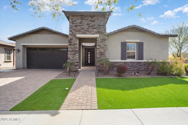 view of front of house featuring an attached garage, stone siding, decorative driveway, and stucco siding