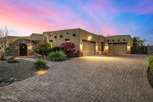 southwest-style home with a garage