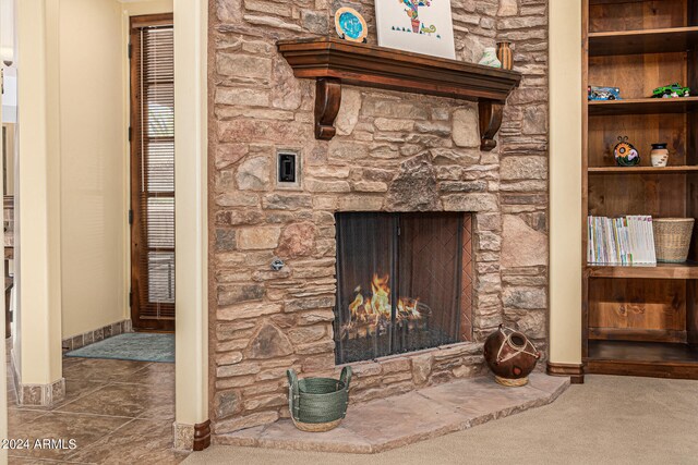 details featuring carpet flooring and a fireplace