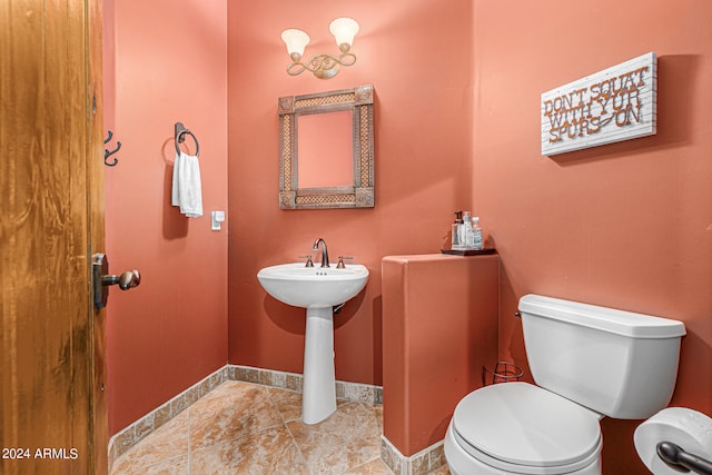 bathroom with tile patterned floors and toilet