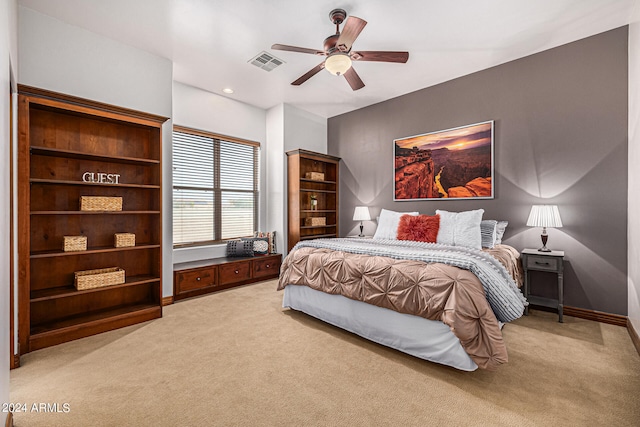 carpeted bedroom featuring ceiling fan