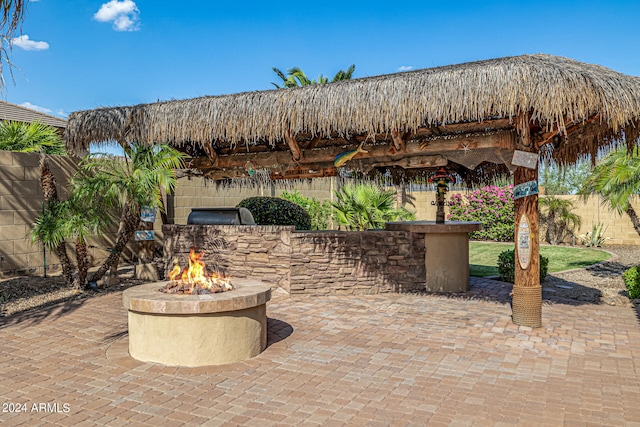 view of patio with an outdoor fire pit