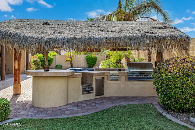 view of patio featuring grilling area and an outdoor kitchen