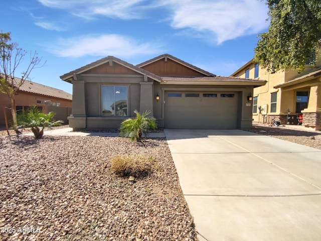 view of front of home featuring a garage, concrete driveway, and stucco siding