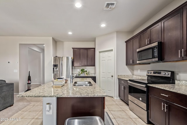 kitchen featuring a sink, visible vents, appliances with stainless steel finishes, and light tile patterned floors