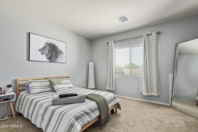 bedroom with baseboards, carpet, and visible vents