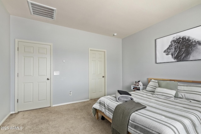 bedroom featuring visible vents, baseboards, and light carpet