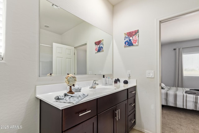 bathroom with vanity, baseboards, and visible vents